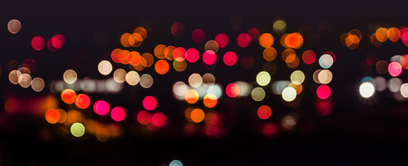 Blur bokeh , red round circles of a evening night city. Motion unfocused image , copyspace photo,...