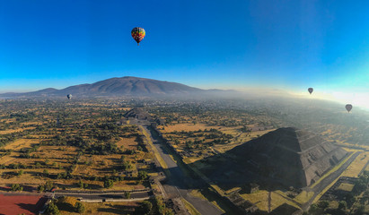 Hot air balloon flying above the Sun Pyramid in Teotihuacan