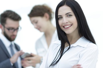 close-up of a beautiful woman manager and co-workers in the office