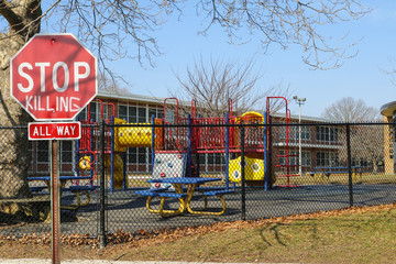Ominous Stop Killing Sign at Grammar School