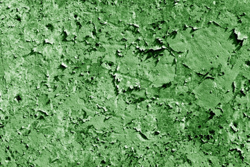 Grungy cement wall texture in green color.
