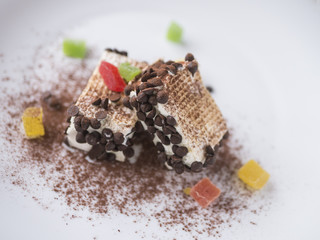 Italian ice cream dark chocolate, colorfull dried fruit, white background