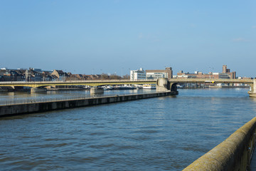 Fototapeta na wymiar Pedestrian bridge over river Maas