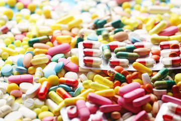 Colorful medicine pills and blister close up