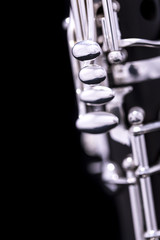 A new silver plated clarinet on a black background - obrazy, fototapety, plakaty
