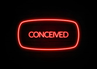Conceived neon sign on brick wall background.