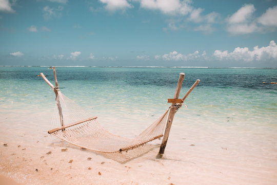 Empty hammock hanging on the beach