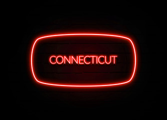 Connecticut neon sign on brick wall background.