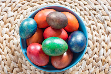 Easter colored eggs on old basket