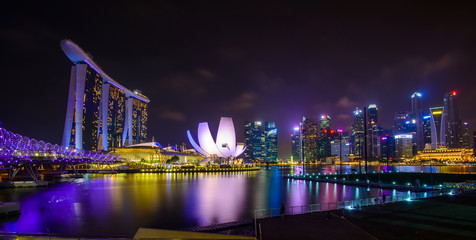 Singapore skyline with urban buildings over water - Powered by Adobe
