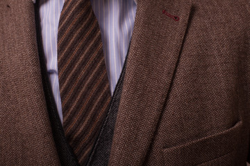 Man with retro camera in tweed vintage dress

