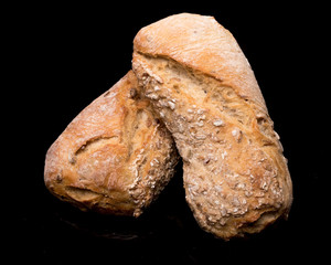 bread roll, bread on a black background, isolated