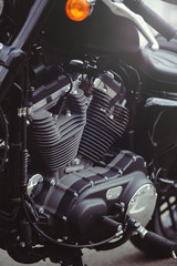 Plakat beautiful black motorcycle motor close-up, view of the filter