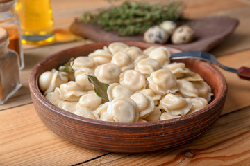 Plate with tasty meat dumplings on table