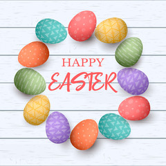 Easter colorful eggs with different simple ornaments in circle frame. white wooden background.