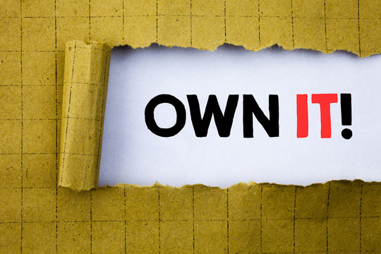 Own It Exclamation. Business concept for Ownership Control written on white paper on the yellow folded paper.