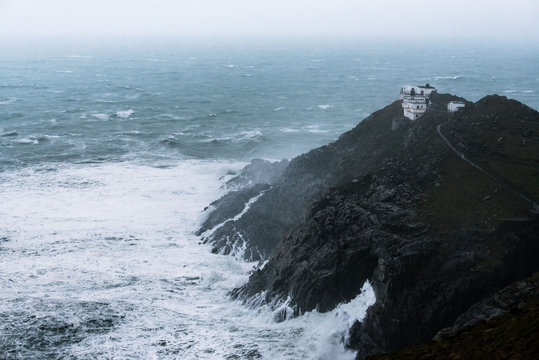 Cliffs at Mizen Head signal station on the south Ireland coast during heavy storm and crashing waves