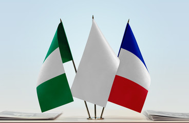 Flags of Nigeria and France with a white flag in the middle