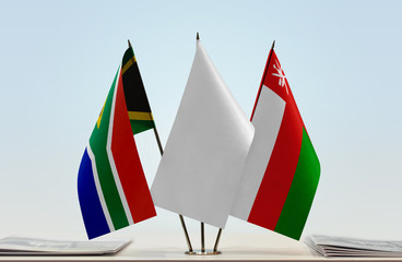 Flags of Republic of South Africa and Oman with a white flag in the middle