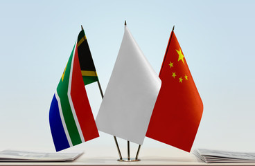 Flags of Republic of South Africa and China with a white flag in the middle