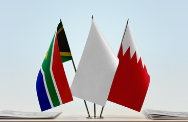 Flags of Republic of South Africa and Bahrain with a white flag in the middle