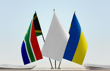 Flags of Republic of South Africa and Ukraine with a white flag in the middle
