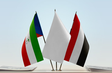 Flags of Equatorial Guinea and Yemen with a white flag in the middle