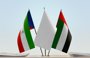 Flags of Equatorial Guinea and UAE with a white flag in the middle