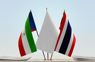 Flags of Equatorial Guinea and Thailand with a white flag in the middle