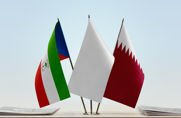 Flags of Equatorial Guinea and Qatar with a white flag in the middle