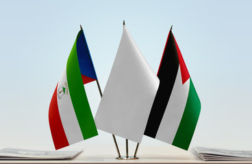 Flags of Equatorial Guinea and Palestine with a white flag in the middle