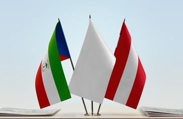 Flags of Equatorial Guinea and Austria with a white flag in the middle