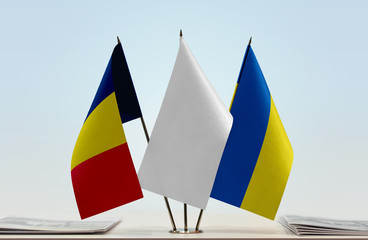 Flags of Chad and Ukraine with a white flag in the middle