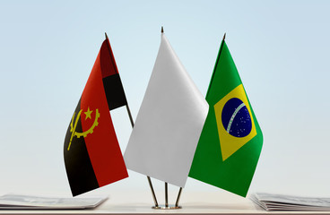 Flags of Angola and Brazil with a white flag in the middle