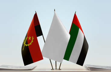 Flags of Angola and UAE with a white flag in the middle