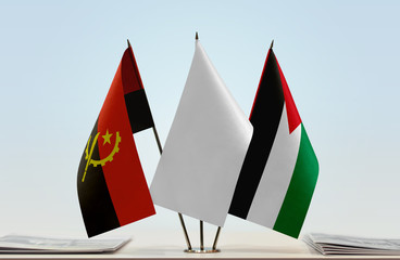 Flags of Angola and Palestine with a white flag in the middle