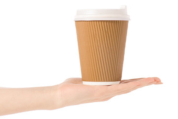 Cardboard glass cup of coffee in hand