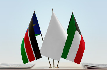 Flags of South Sudan and Kuwait with a white flag in the middle