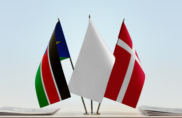 Flags of South Sudan and Denmark with a white flag in the middle