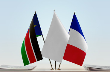 Flags of South Sudan and France with a white flag in the middle