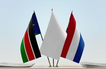 Flags of South Sudan and Netherlands with a white flag in the middle