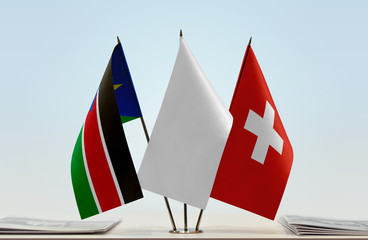 Flags of South Sudan and Switzerland with a white flag in the middle