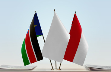 Flags of South Sudan and Monaco with a white flag in the middle