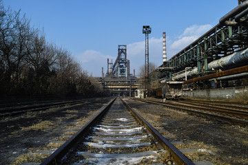 Naklejka premium Rusted railway and abandoned steelmaking equipments