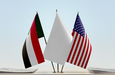 Flags of Sudan and USA with a white flag in the middle