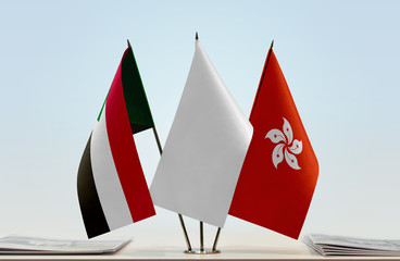 Flags of Sudan and Hong Kong with a white flag in the middle