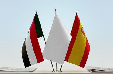 Flags of Sudan and Spain with a white flag in the middle