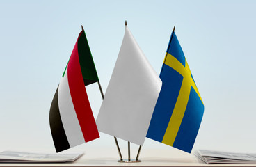 Flags of Sudan and Sweden with a white flag in the middle