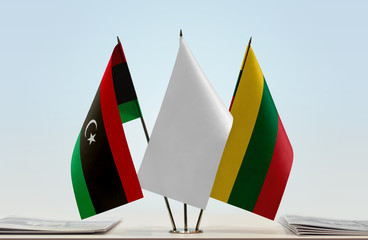 Flags of Libya and Lithuania with a white flag in the middle