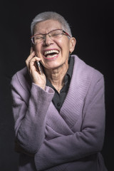 Cute senior woman enjoying a phone talk